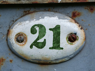 Old house door number plate twenty one. House number twenty one