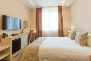 Hotel room interior,double bed beige bedroom
