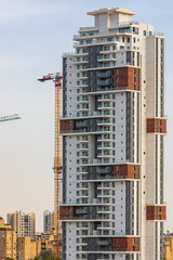 Fototapeta na wymiar Tall residential building under construction