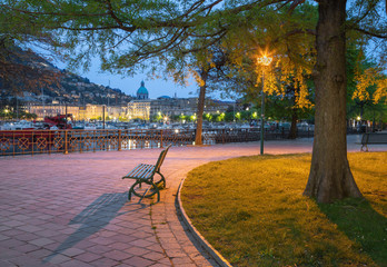 Como - The city with the Cathedral and harbor from the promenade in the morning dusk.