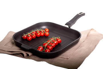 frying pan with red tomato