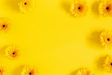 Flowers composition. Yellow gerbera flowers on yellow background. Flat lay, top view, copy space - obrazy, fototapety, plakaty