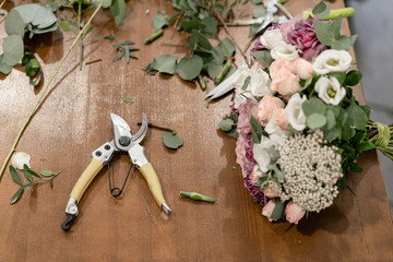 Master class on making bouquets. Summer bouquet. Learning flower arranging, making beautiful bouquets with your own hands. Flowers delivery