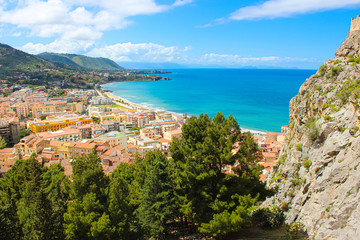 Fototapeta na wymiar Amazing panoramic view of Sicilian city Cefalu located on the Tyrrhenian coast taken from a view point. The beautiful city is one of the major tourist destinations in Italy