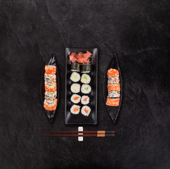 Top shot of Japanese sushi on black concrete background