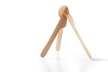 Eco-friendly materials. Wooden, disposable tableware on a white background.