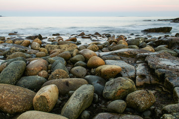 A rocky ocean beach at twilight.  Acadia National Park, ME, USA.