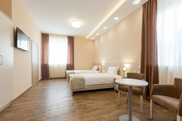 Naklejka na ściany i meble Interior of a double bed hotel bedroom
