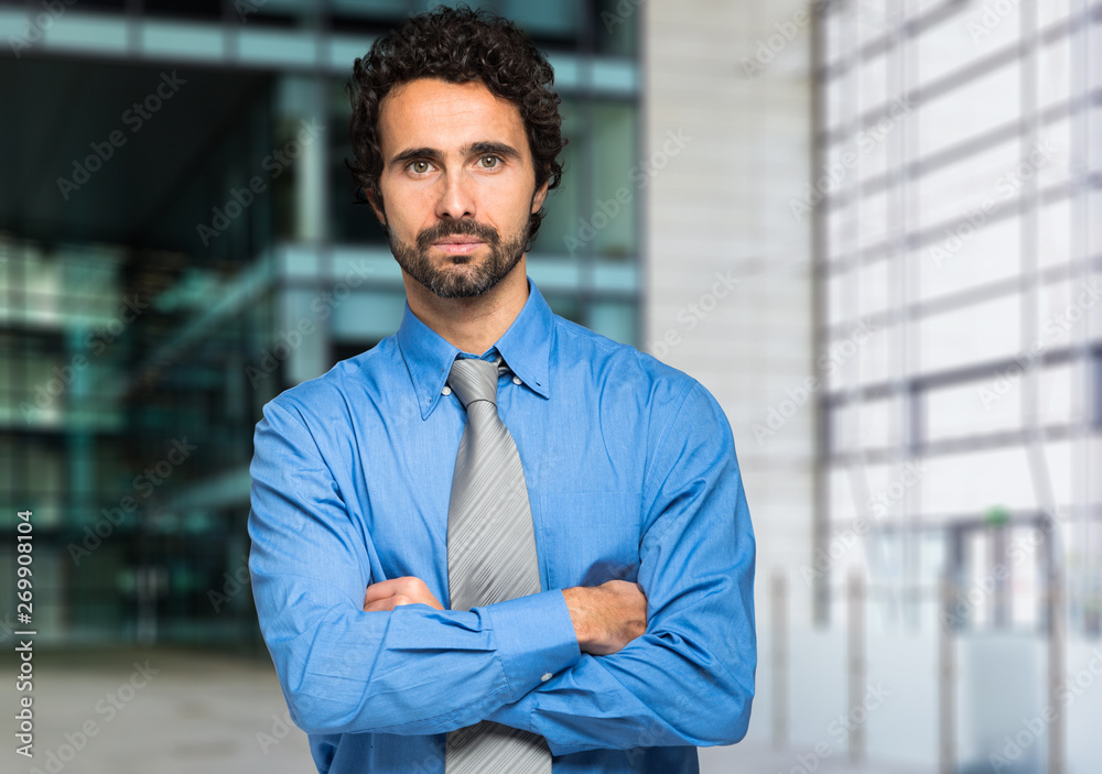 Wall mural portrait of a handsome businessman in a modern office