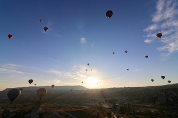 Hot air balloons over Goreme, Turkey, during sunrise.