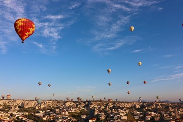 Hot air balloons over Goreme, Turkey, during sunrise.
