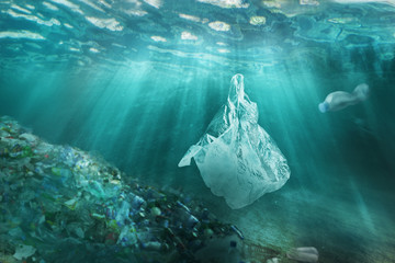 Plastic pollution in ocean environmental problem. Plastic bags and bottles pollute sea. Underwater...
