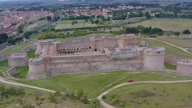Landscape of Fort of Salses and village Salses-le-Ch&acirc;teau as a background. It was designed by engineer Francisco Ramiro Lopez, the king&rsquo;s commander and artillery master, to block access to France
