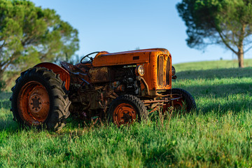 Old tractor in a field, Tuscany, Italy, agriculture