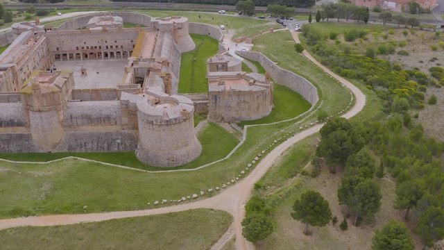 The walls of Fortress of Salses are around 10 metres thick, and the fortress is divided over seven levels served by a maze of corridors and multiple interior defensive chicanes.