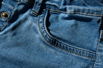 Closeup of blue jeans pocket