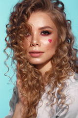 Fototapeta premium Pretty girl with curls hairstyle, classic makeup, freckles, nude lips Beauty face.