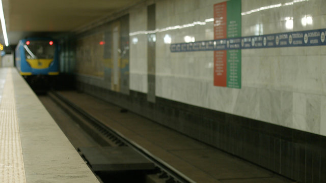Subway train moving on a subway station. Blurred image of underground train arriving at modern subway station.
