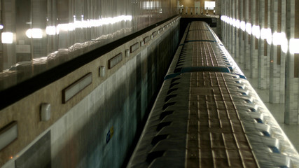 Metro train moving in tunnel, top view. Underground train arriving at subway station, view from above.