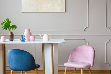 pink and blue armchair in the dining room