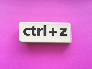 eraser with the inscription "ctrl + z" on a violet background