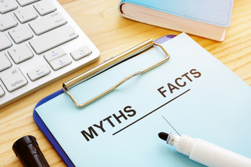 Myths and facts list with pen. Fake news concept.