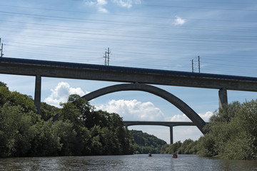 Travelers with canoe on the lahn river in hesse germany