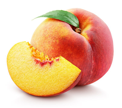 Ripe whole peach fruit with green leaf and slice isolated on white background with clipping path. Full depth of field.
