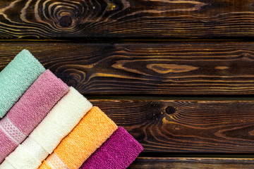 Obraz na płótnie Canvas Bath accessories made of cotton set with towels on wooden background top view mockup
