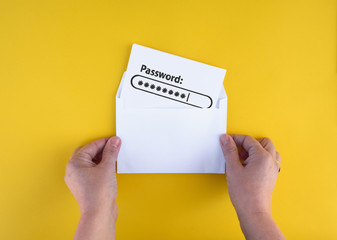 Female hand hold letter with password  in envelope