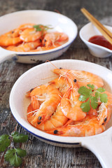 Two portions of fried shrimp and spicy red sauce