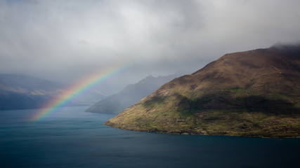 mountain coast with rainbow