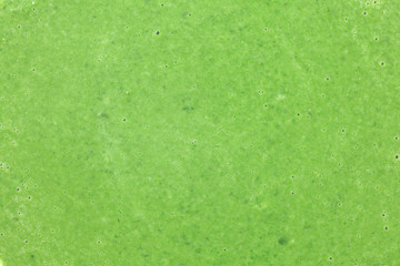 Closeup of spinach soup, detail bubbles on green liquid. Healthy leaves vegetables food concept