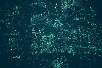 Vintage azure background. Rough painted wall of turquoise color. Imperfect plane of cyan colored. Uneven old decorative toned backdrop of aqzure tint. Texture of teal hue. Ornamental stony surface.