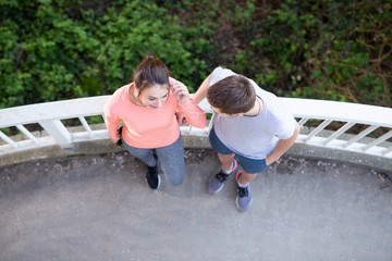 Young and beautiful couple standing outdoors