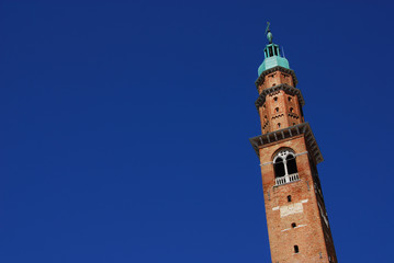 Obraz premium Bissara Tower with blue sky, completed in the 15th century, it's the tallest building in Vicenza (with copy space)