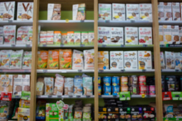 Blurred photo of healthy food products in the store. Healthy diet, eating