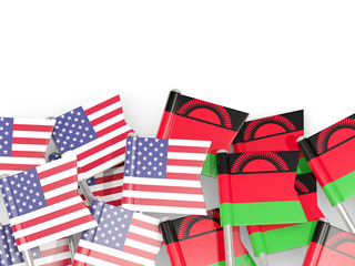 Pins with flags of United States and malawi isolated on white