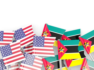 Pins with flags of United States and mozambique isolated on white