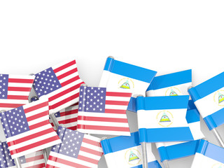 Fototapeta na wymiar Pins with flags of United States and nicaragua isolated on white