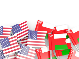 Obraz premium Pins with flags of United States and oman isolated on white