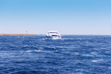 Boat Wave ocean trace on blue sea fresh water background.