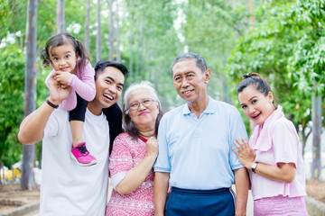 Three generation family smile at the camera