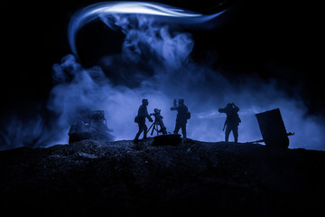 War Concept. Military silhouettes fighting scene on war fog sky background,