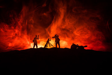Fototapeta premium War Concept. Military silhouettes fighting scene on war fog sky background,