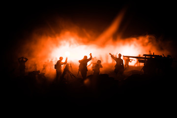 Fototapeta premium War Concept. Military silhouettes fighting scene on war fog sky background,