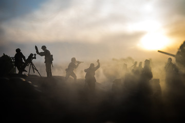 Fototapeta premium War Concept. Military silhouettes fighting scene on war fog sky background,