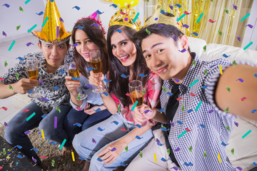 Young people taking photo at a birthday party