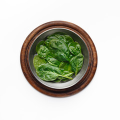 Fresh Basil Leaves In Bowl On Wooden Board