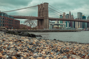 Pebble beach and Brooklyn Bridge in the background